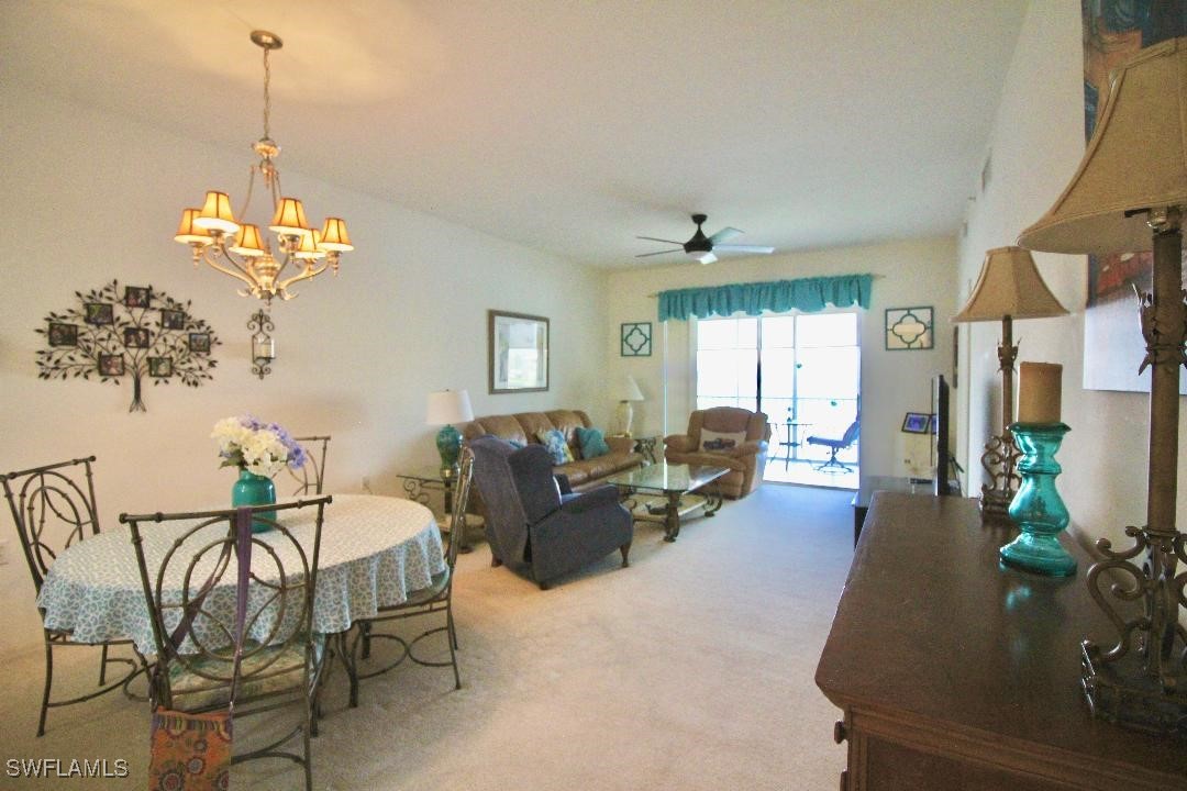 a living room with furniture chandelier and a chandelier