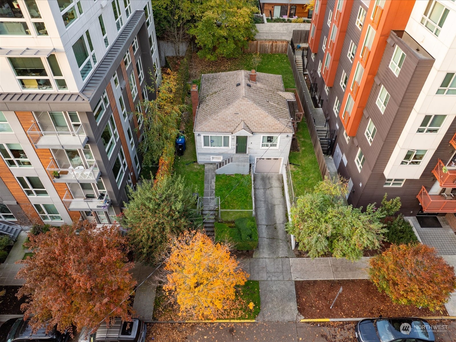 an aerial view of residential houses with outdoor space