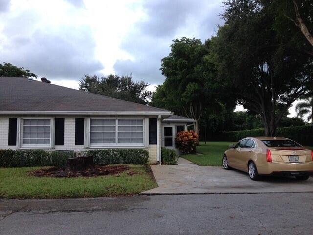 a view of a car parked in front of a house