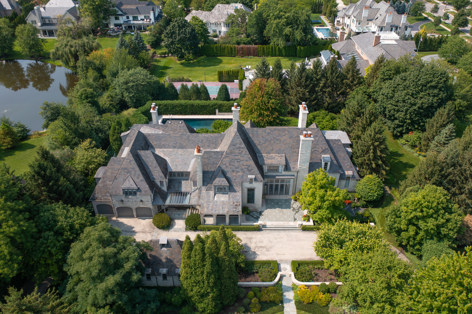 an aerial view of a house with a garden