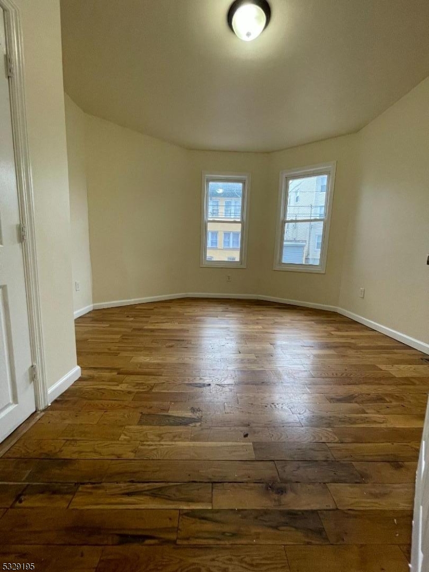 a view of room and hardwood floor