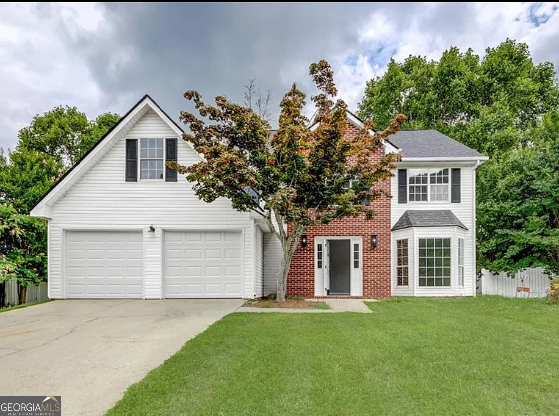 front view of a house with a yard