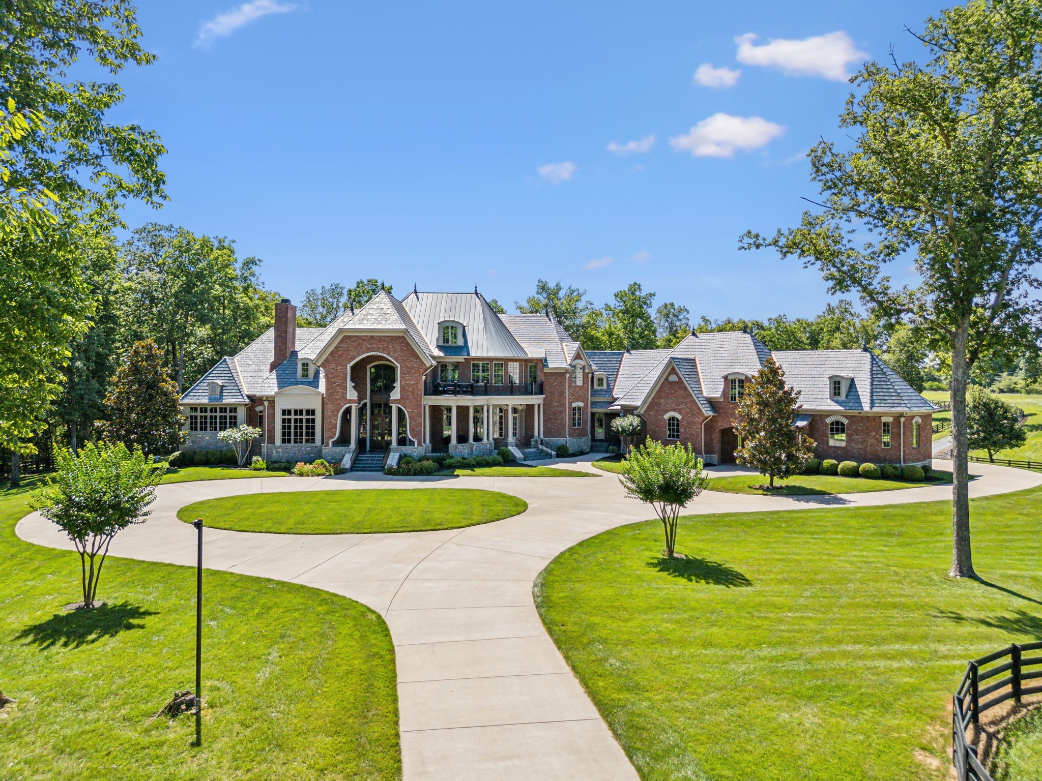 a front view of a house with swimming pool having outdoor seating