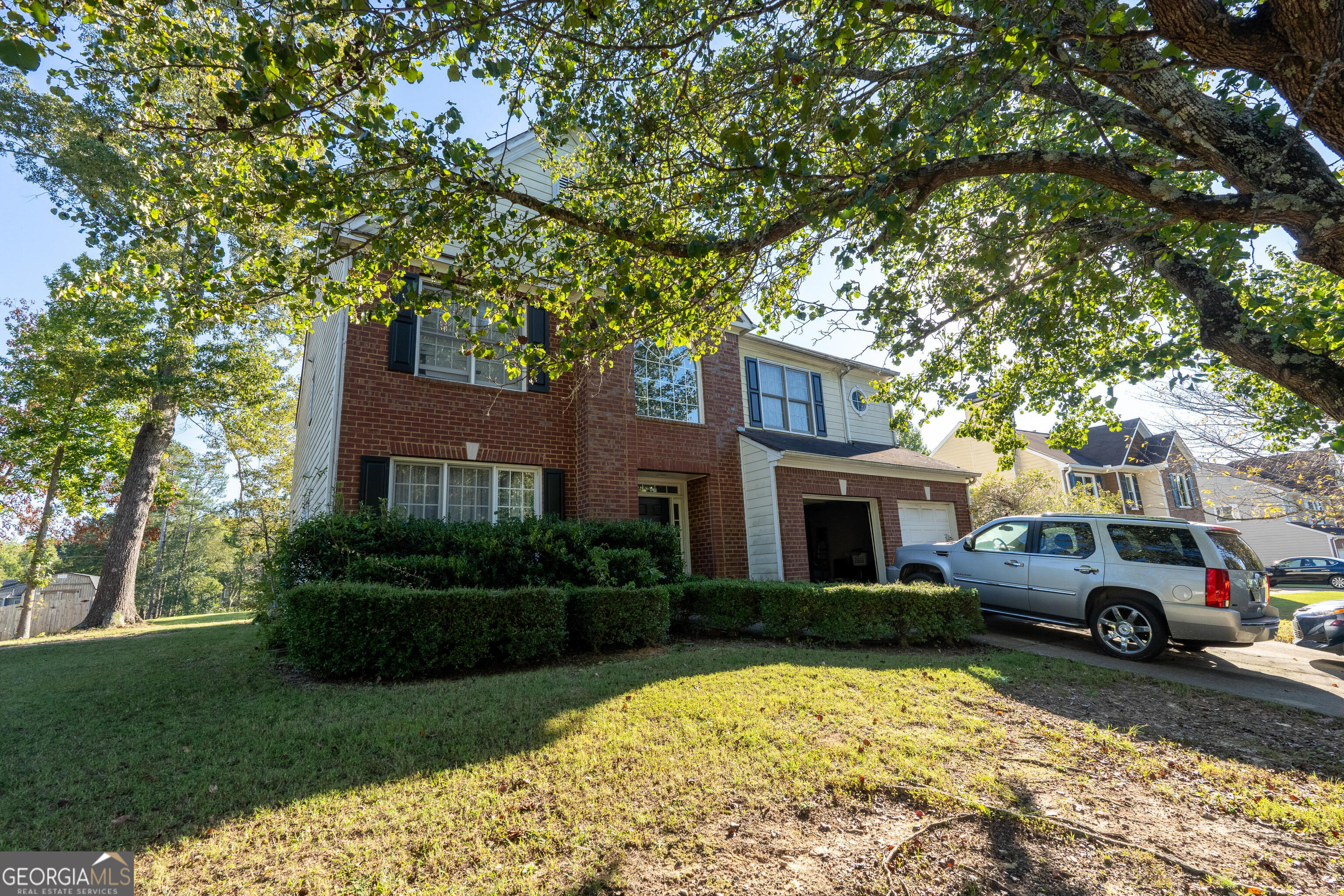 a front view of a house with a yard