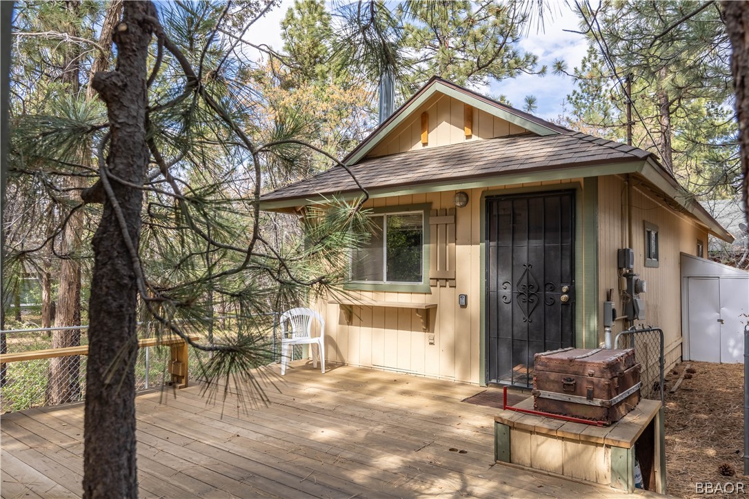 a front view of a house with outdoor seating yard and wooden floor