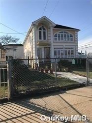 a front view of a house with garage