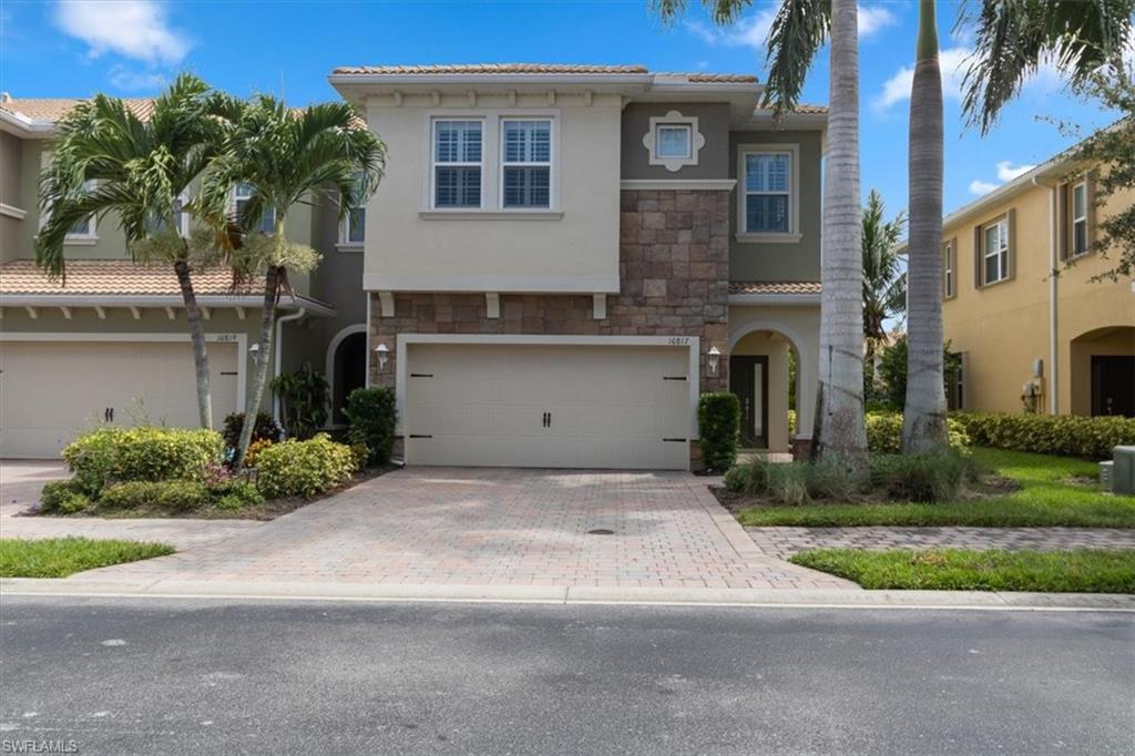 a house with a yard and a garage