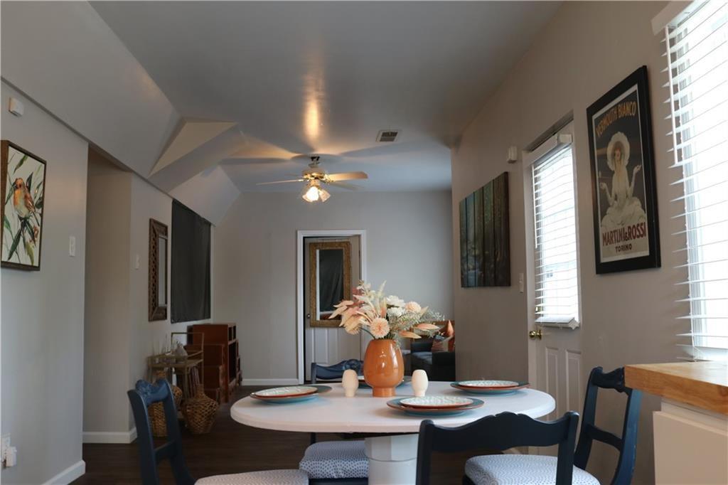 a dining room with furniture and window