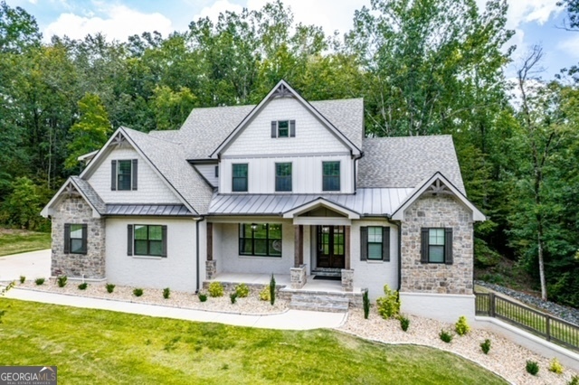 a front view of house with yard outdoor seating and yard