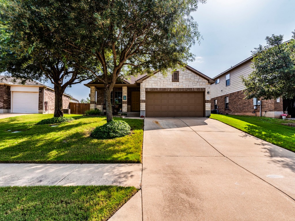 Welcome home! The rock brick mix, trees and landscaping gives this home great curb appeal!