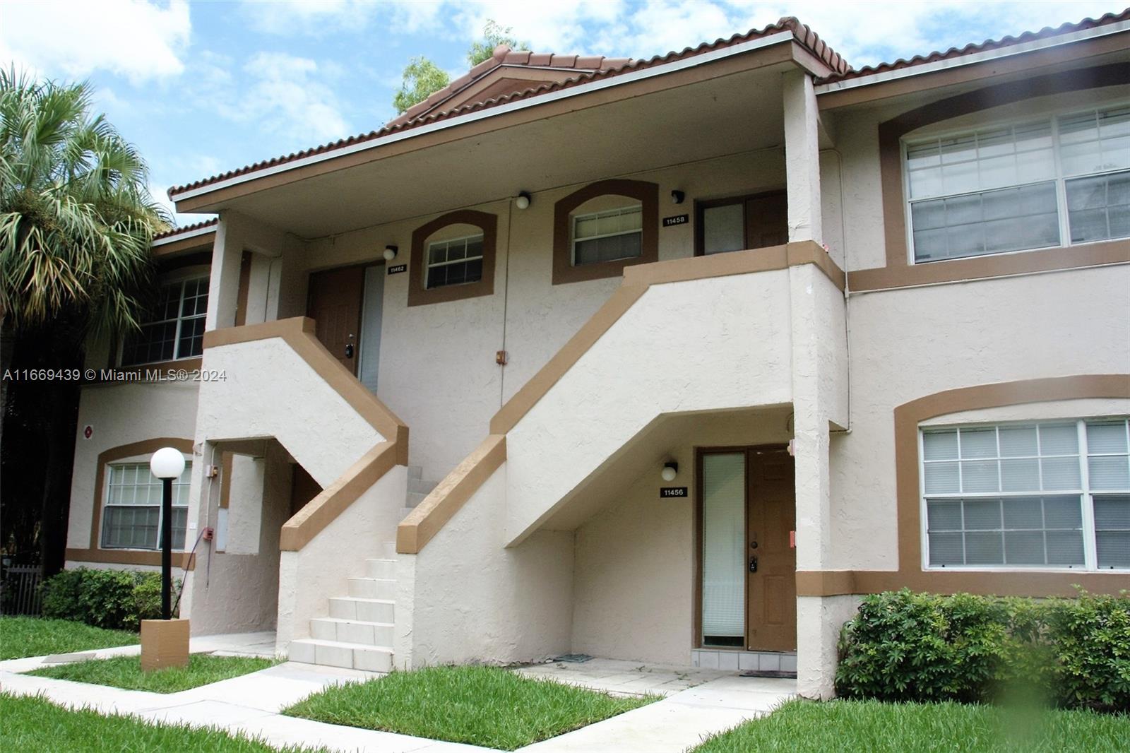 a front view of a house with garage