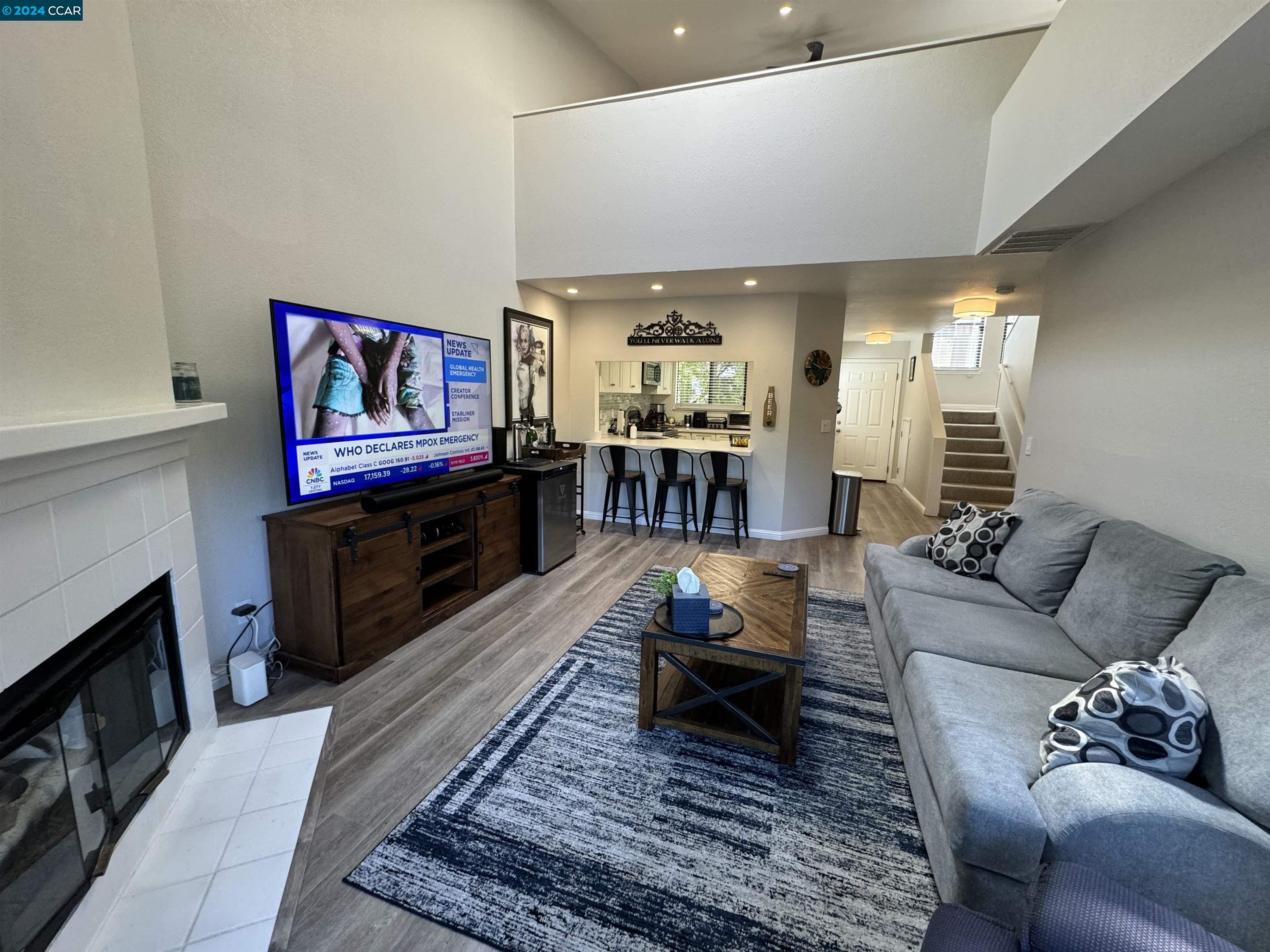 a living room with furniture and a fireplace