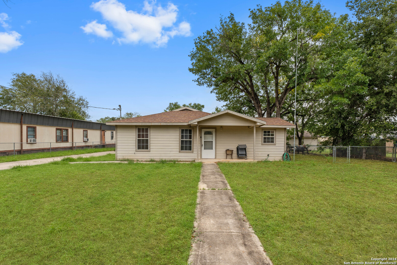 a front view of a house with yard