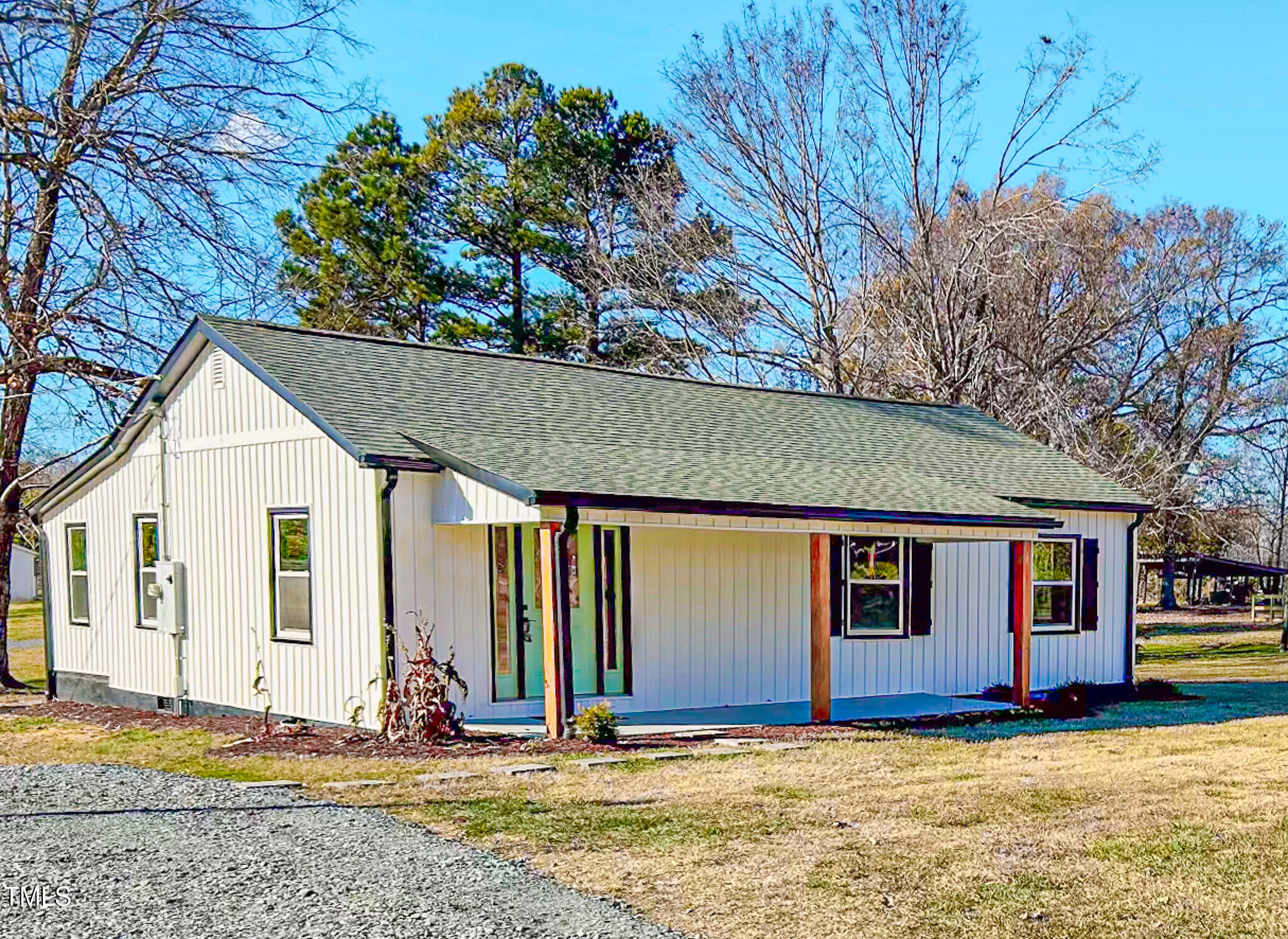 a view of house with yard