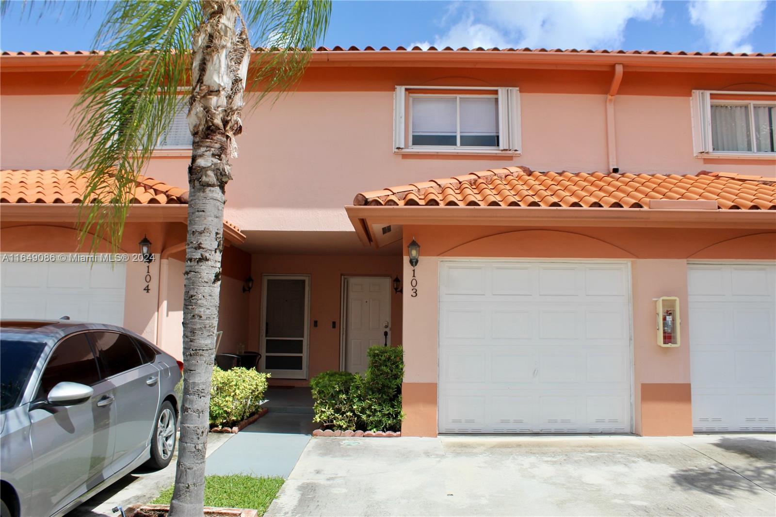 a front view of a house with a garage