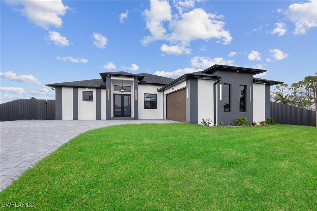 a front view of house with yard and green space