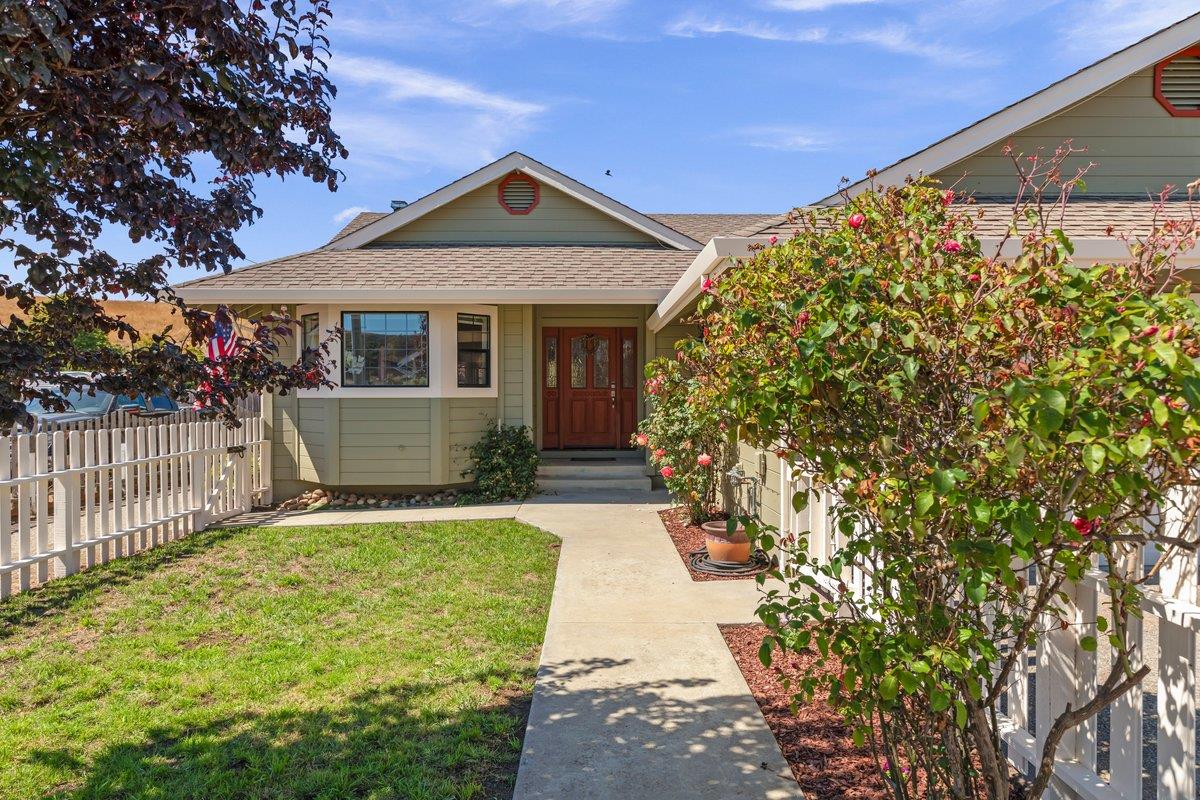 a front view of a house with a yard