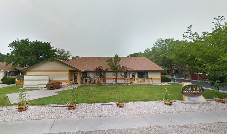 a front view of a house with a garden and plants