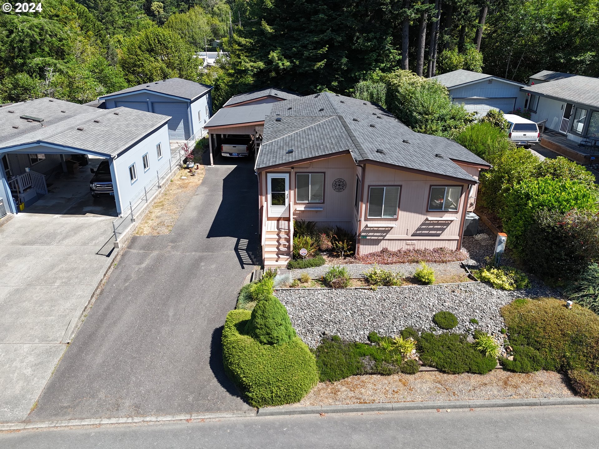 a aerial view of a house with garden and patio