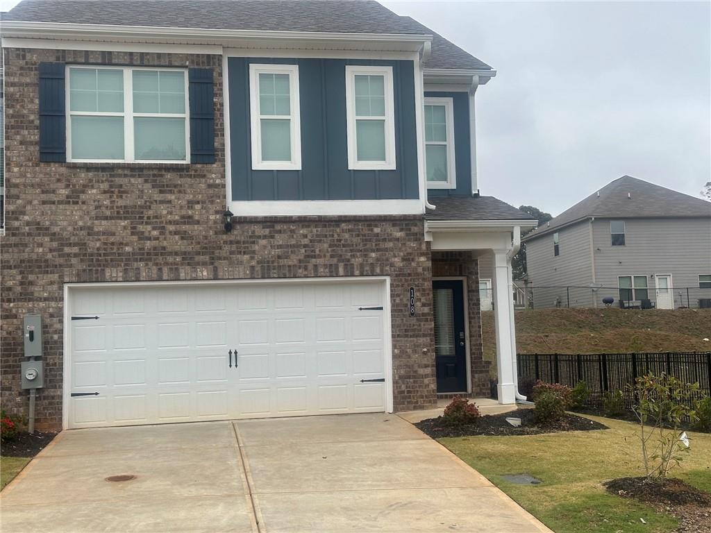 a front view of a house with garage