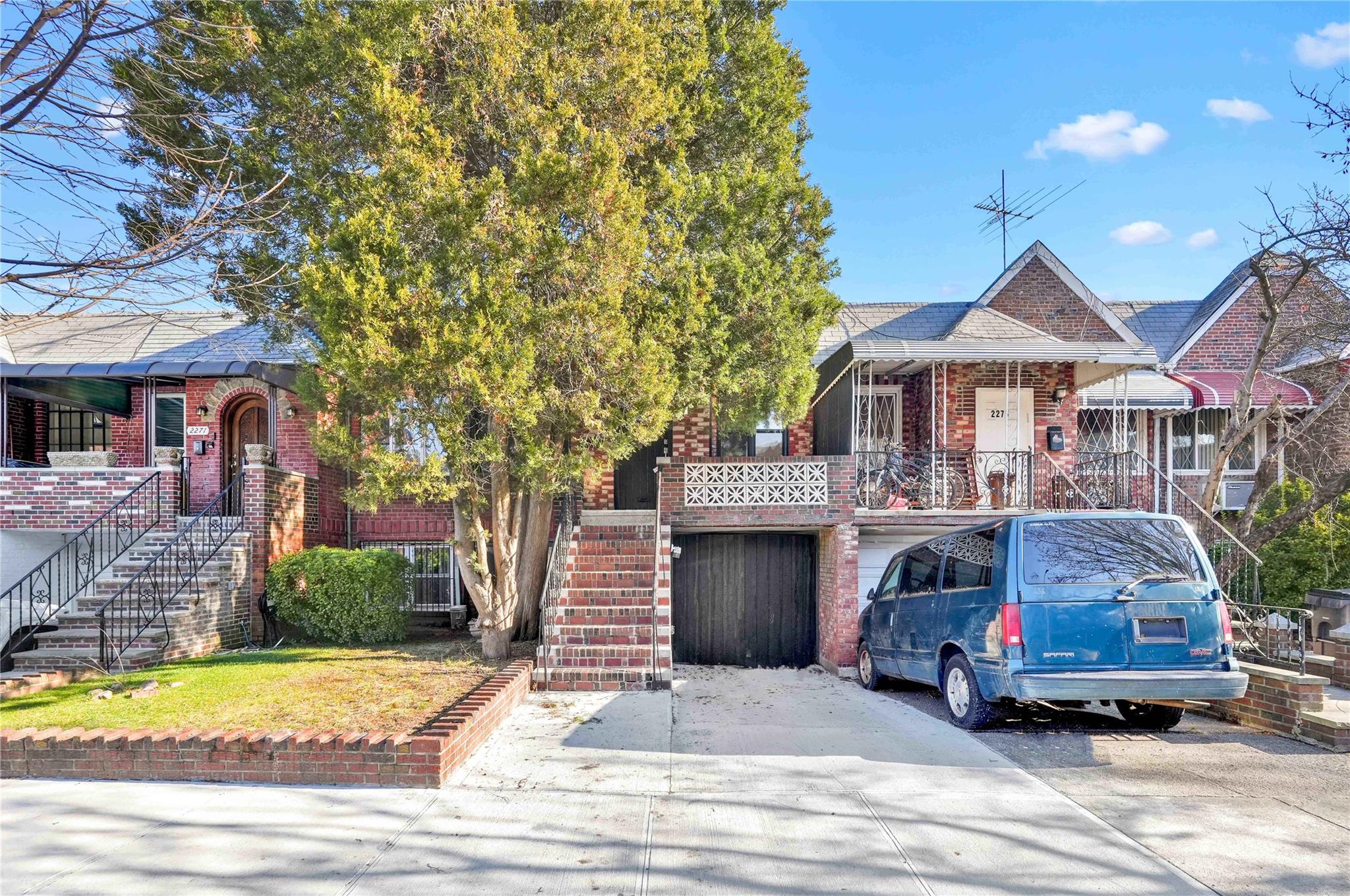 View of front facade featuring a garage