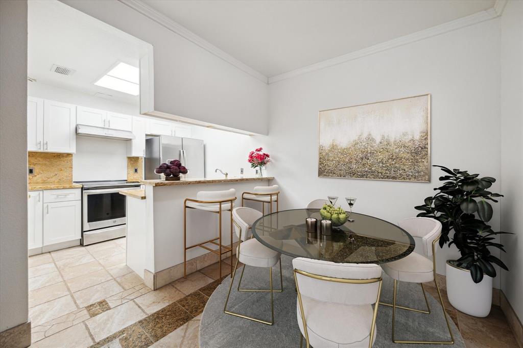 a kitchen with a sink appliances and cabinets