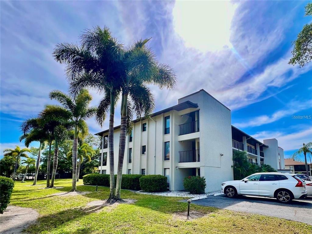 a view of a car park in front of house