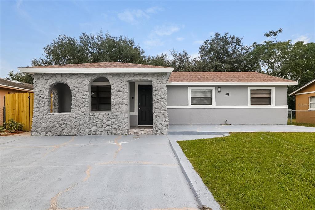 a view of house and outdoor space with yard