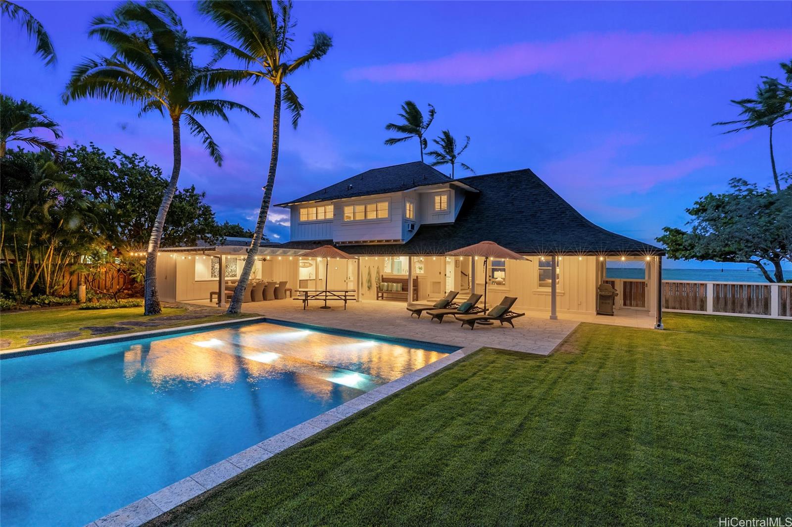 a view of a house with swimming pool yard and sitting area