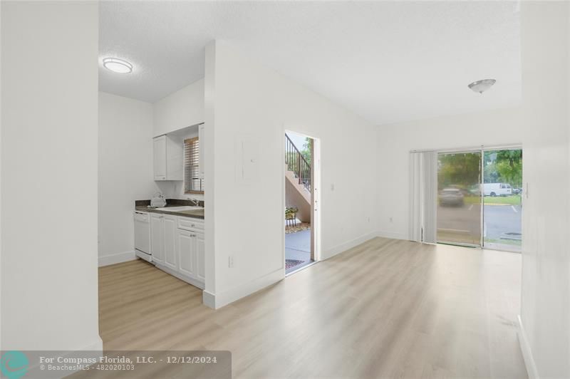 a view of a kitchen cabinets and wooden floor