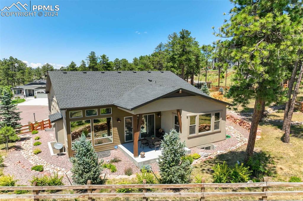 Rear view of house featuring a patio