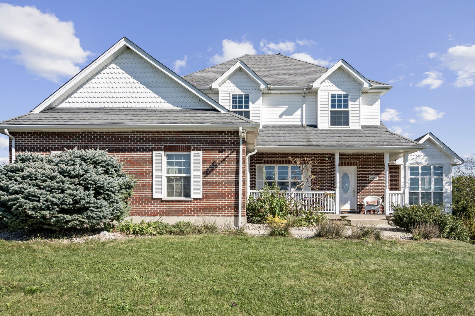 front view of a house with a yard