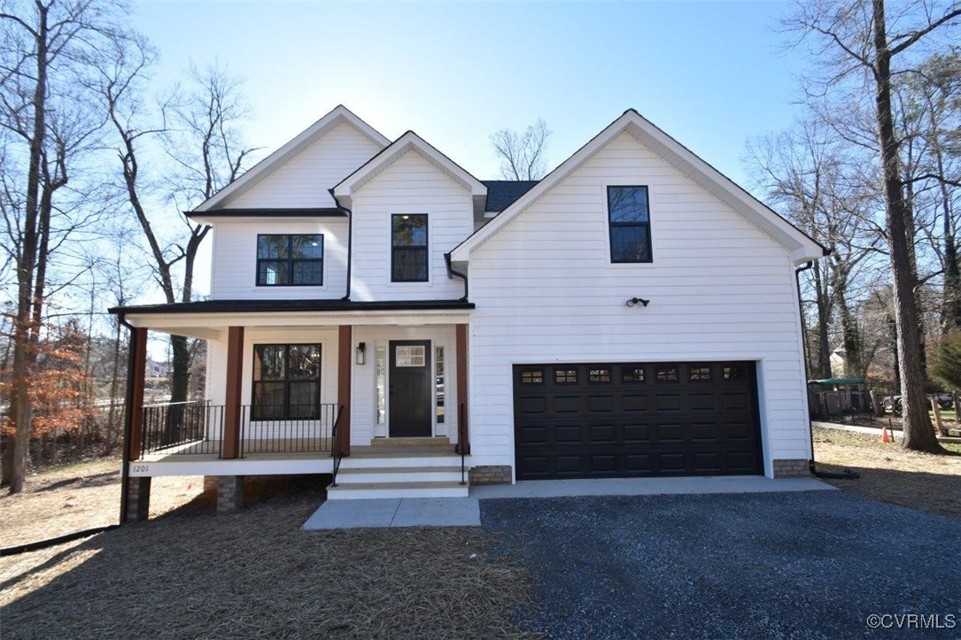 a front view of a house with a garage