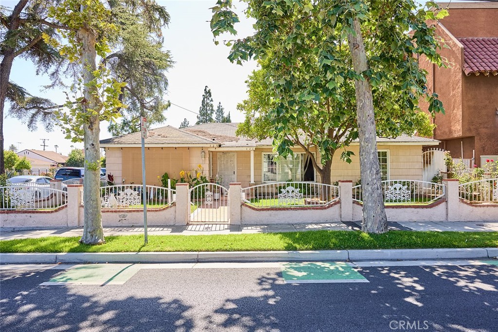 a front view of a house with garden and porch