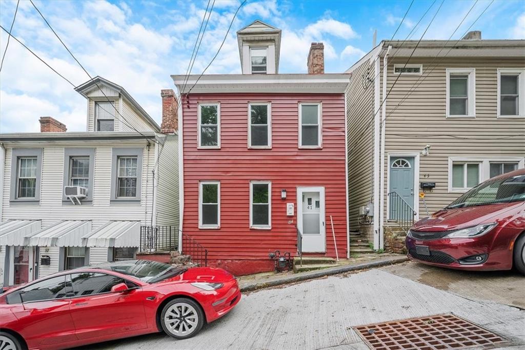 a car parked in front of a house