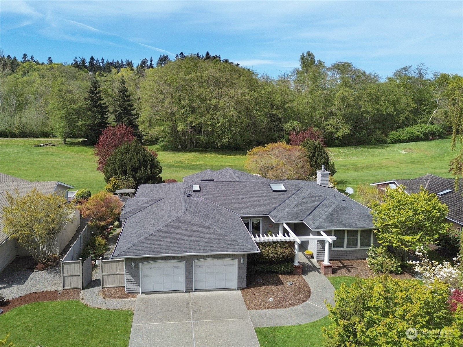 an aerial view of a house with a garden