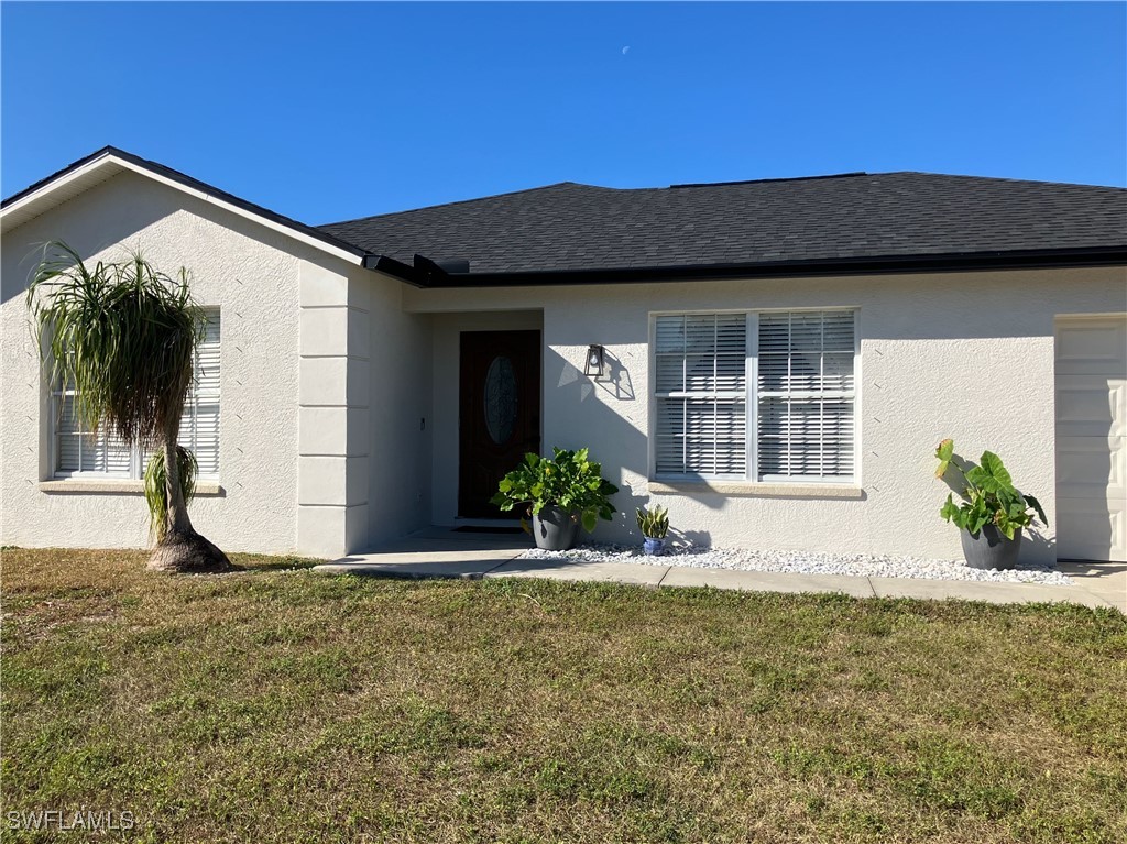 a front view of a house with a yard