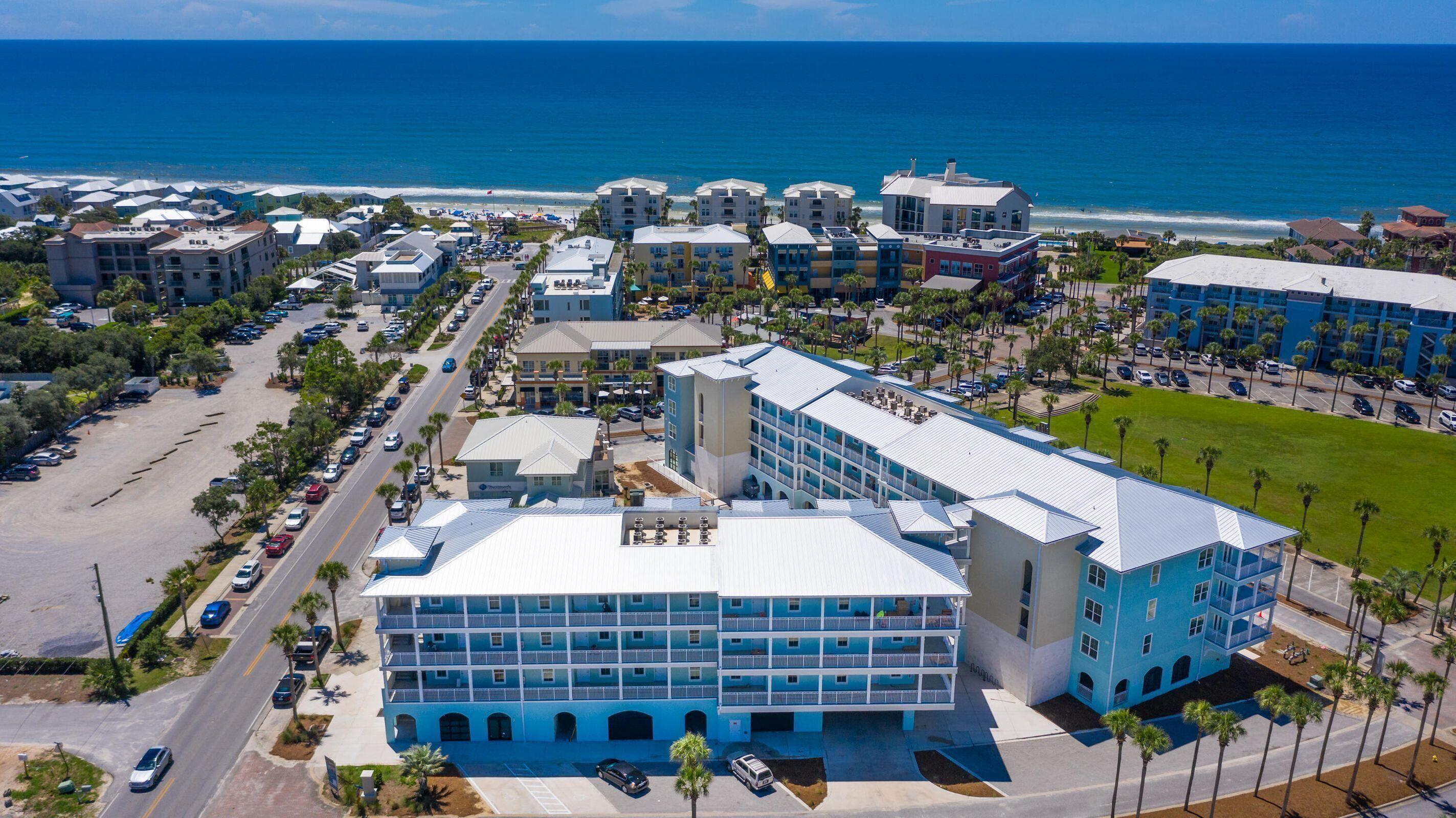 a view of building with outdoor space and parking