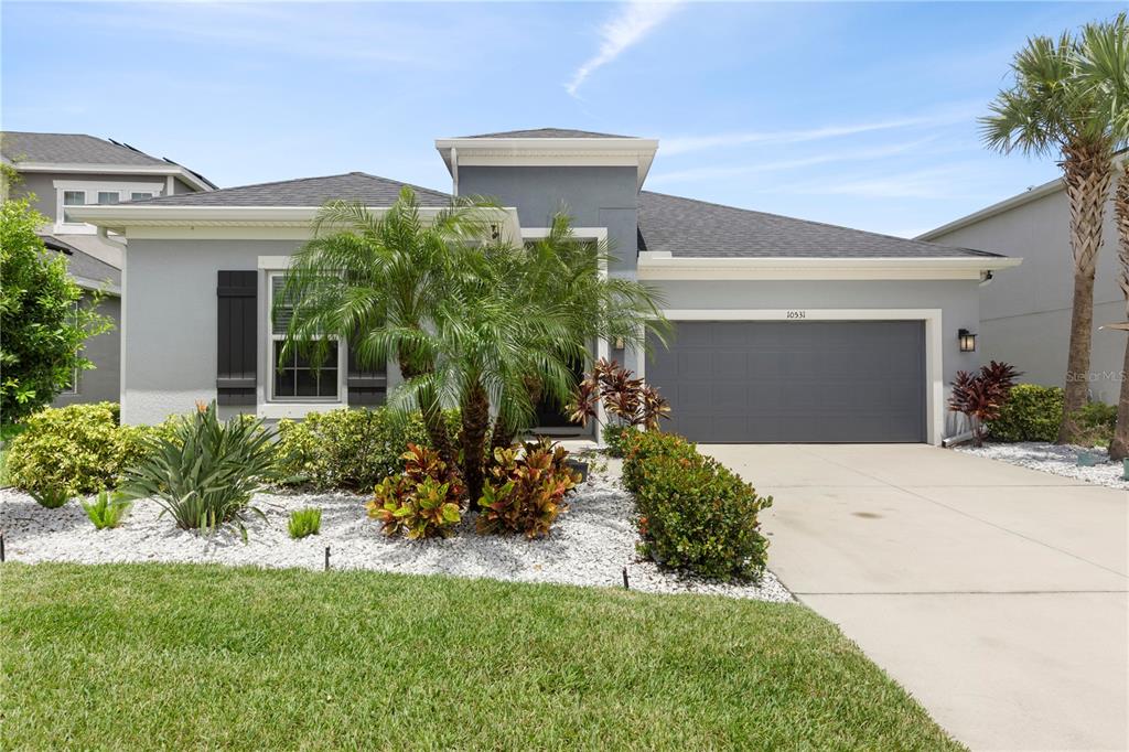 front view of a house with a yard