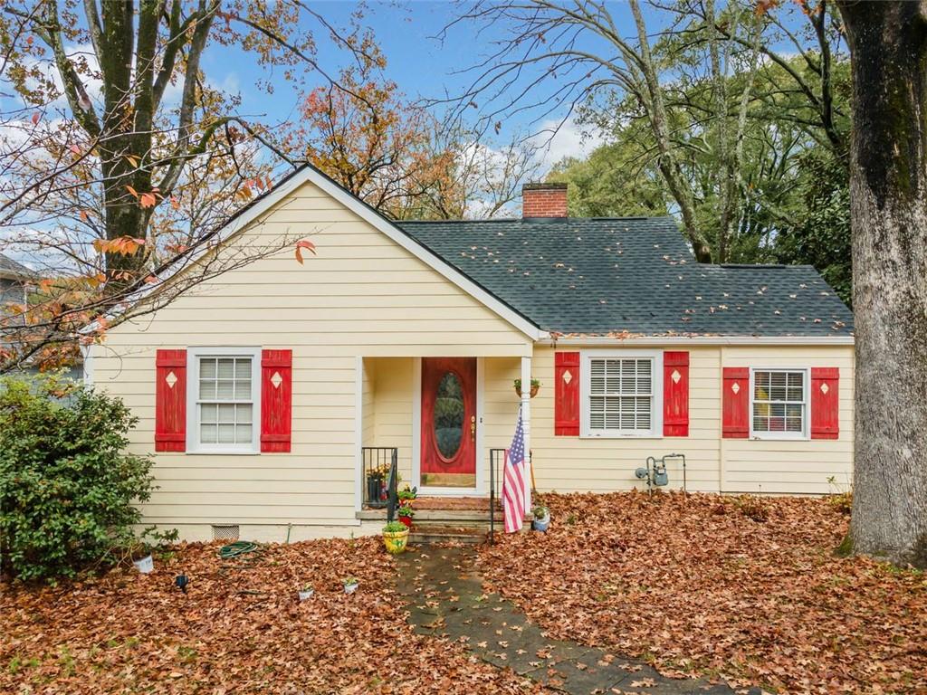 a front view of a house with a small yard