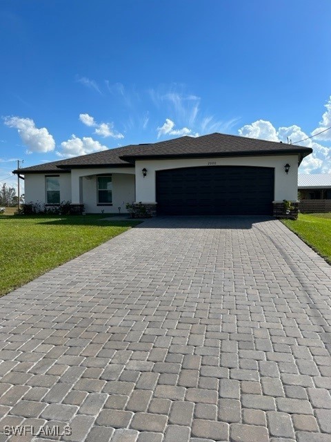 a front view of a house with a yard