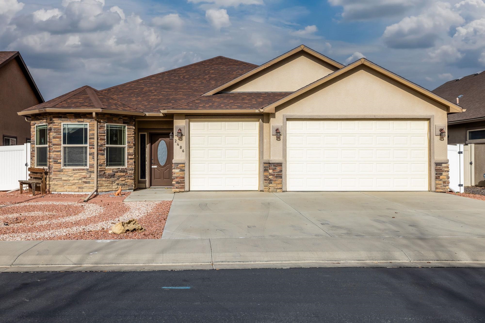 front view of a house with a yard