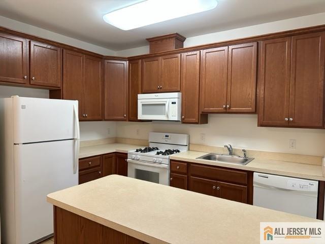 a kitchen with a sink a stove and cabinets