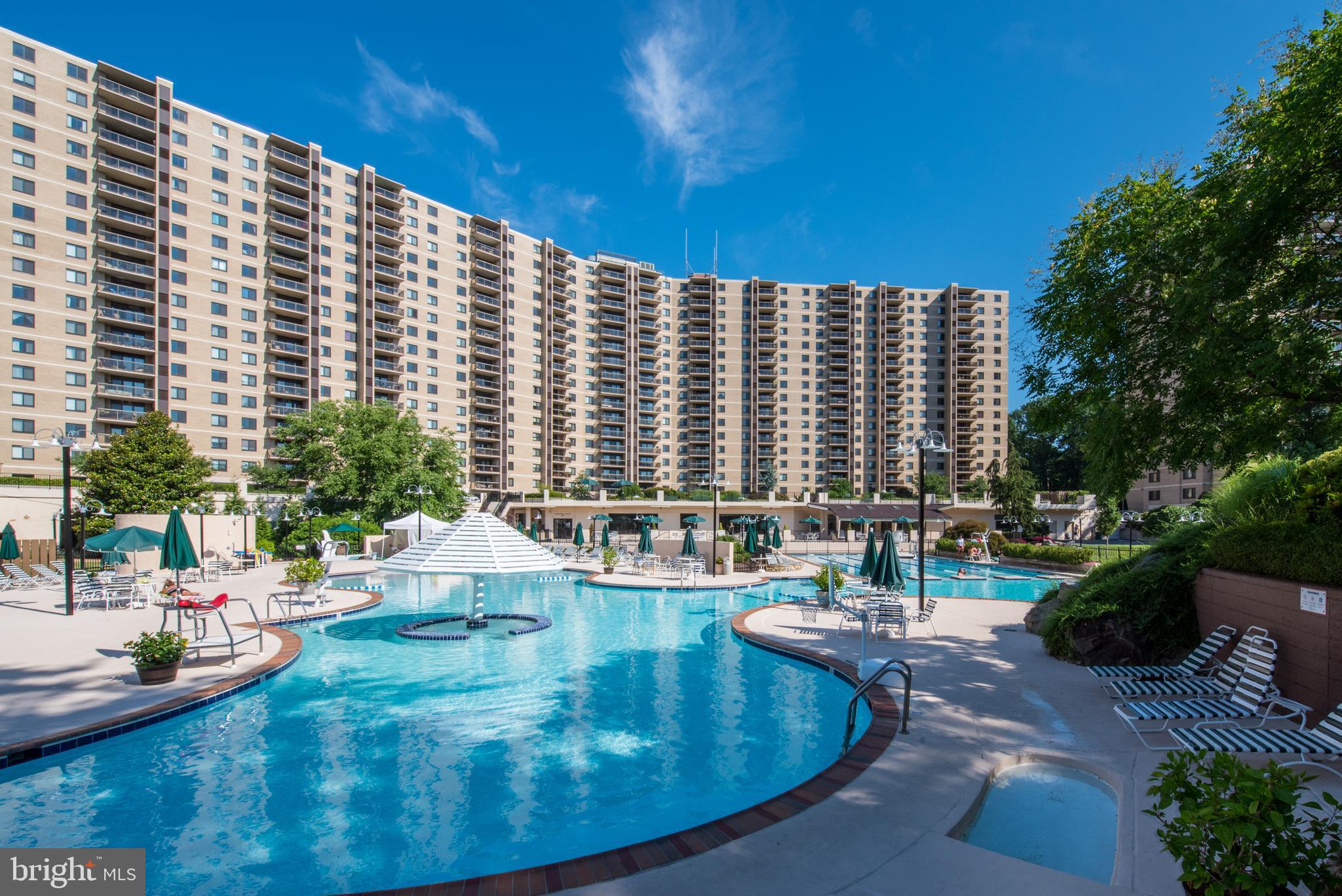 a view of swimming pool with outdoor seating