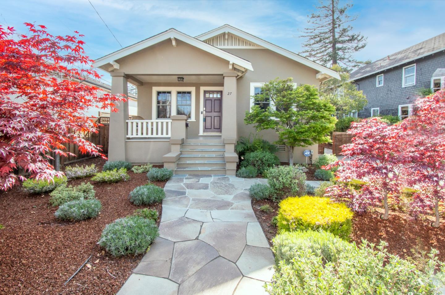 a front view of a house with garden