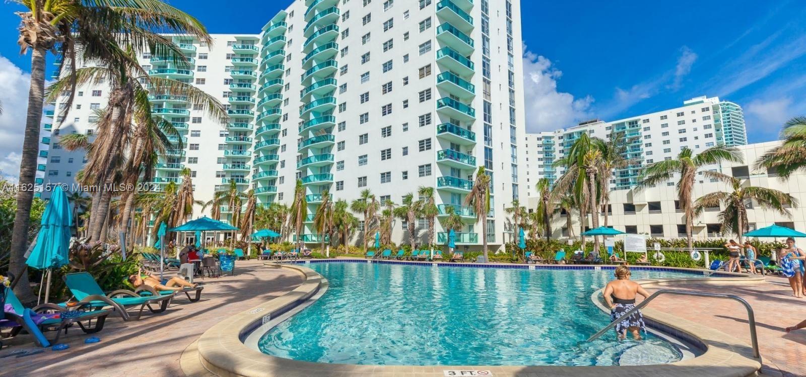 a view of swimming pool with a patio