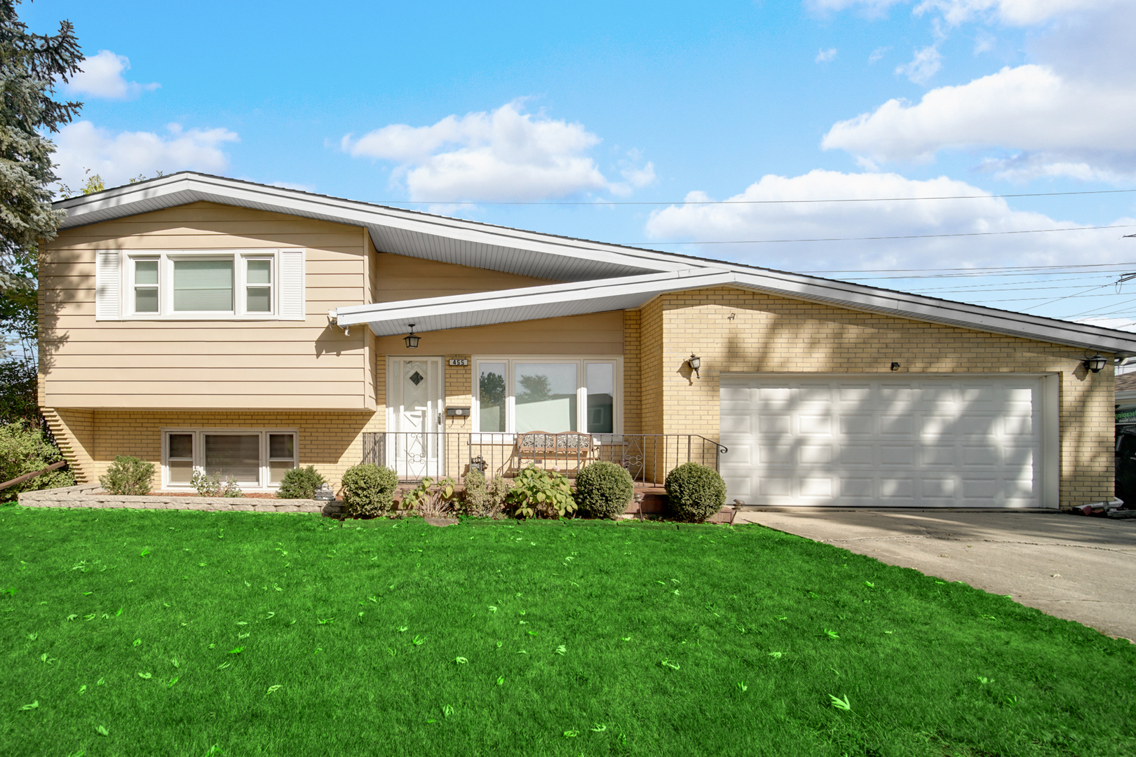 a front view of a house with garden