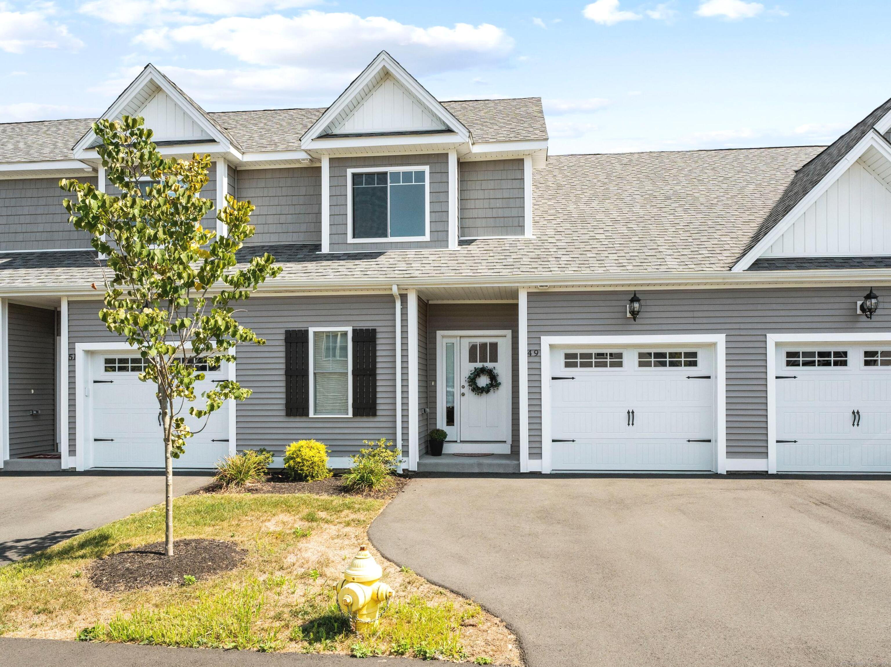 a front view of a house with a yard