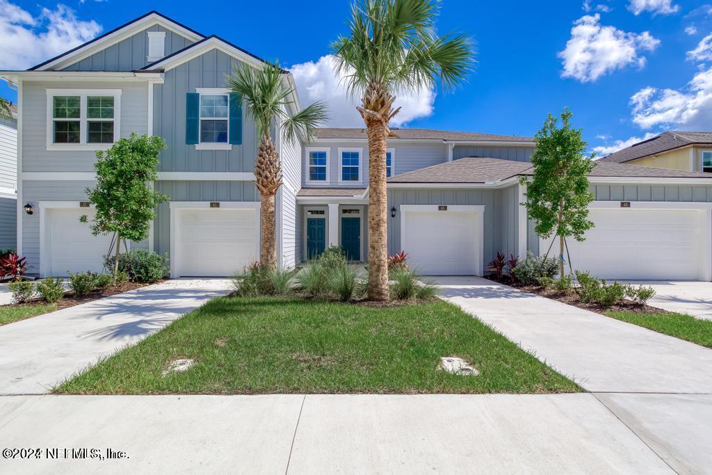 front view of a house with a yard