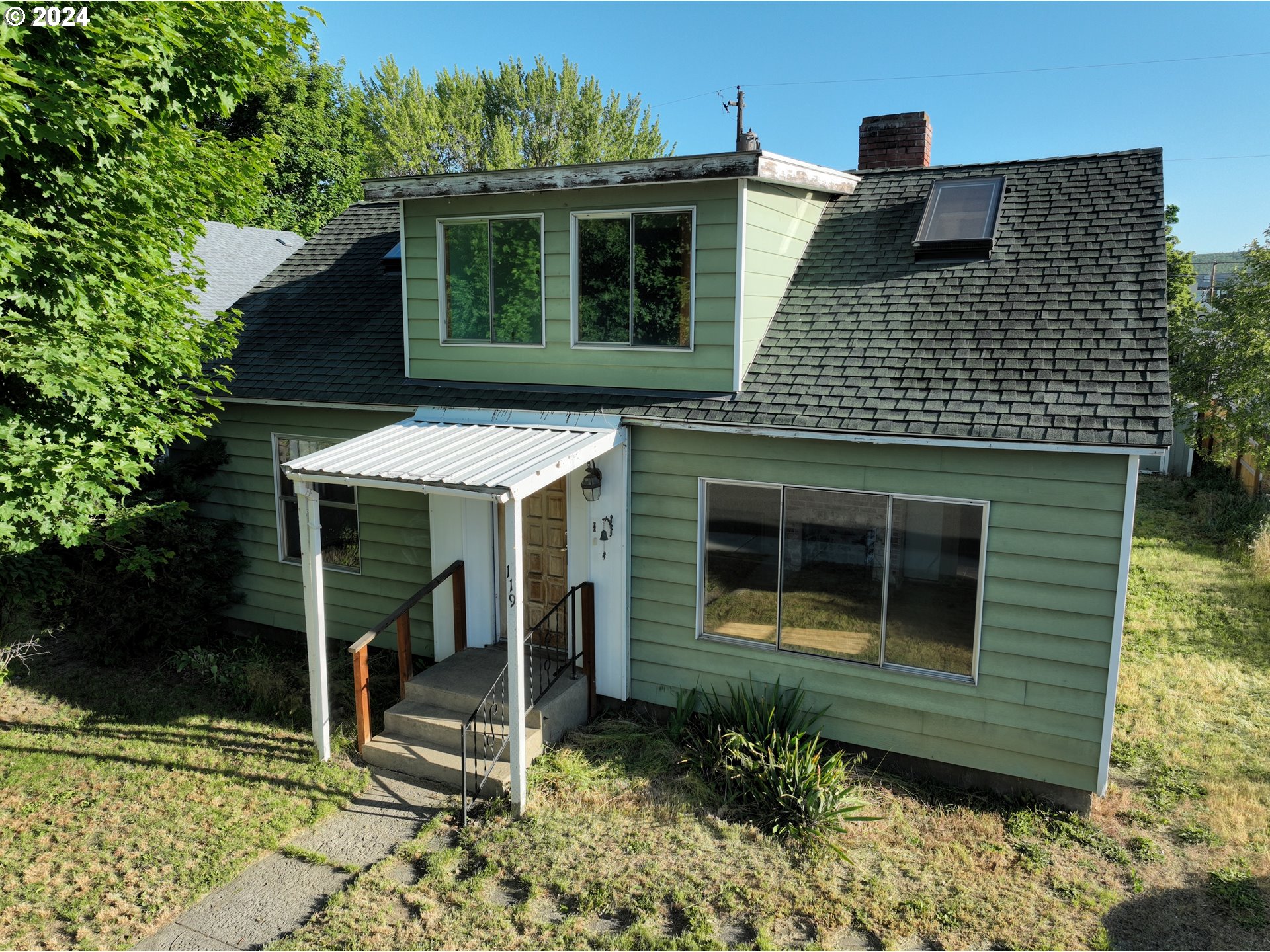 a front view of a house with a yard